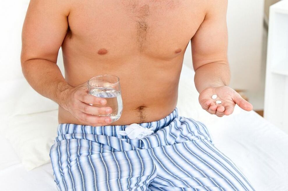 A man takes pills for prostatitis